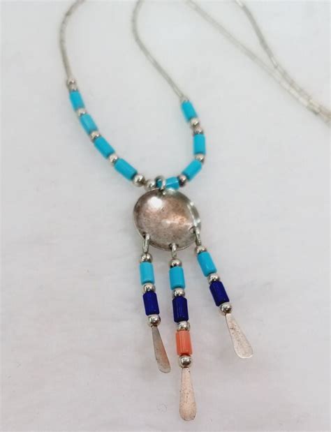 Liquid Silver Shield Necklace With Turquoise Stat Gem