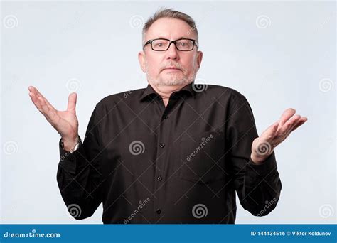 Doubtful Senior Man In Doubt And Unsure Feeling Stock Photo Image Of