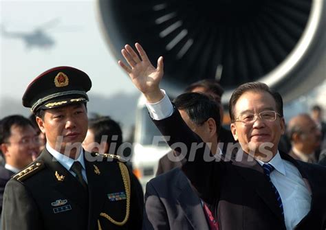 Chinese Premier Wen Jiabao Waves As He Arrives For A Three Day Visit To