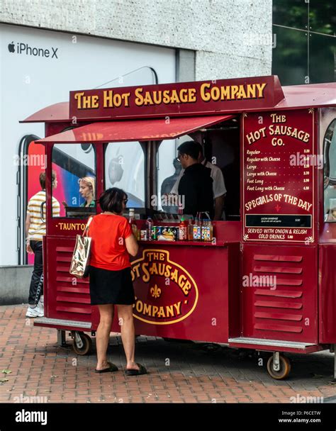 Customer at The Hot Sausage Company fast food stall (tramcar) in New ...