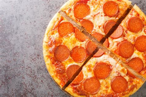 Delicious Sliced Pepperoni Pizza With Sausage And Cheese Close Up On A