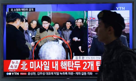 North Koreas Kim Jong Un Poses Next To Miniaturized Nuclear Warhead