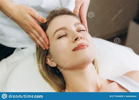 Facial Massage Beauty Treatment Close Up Of A Young Woman S Face Lying