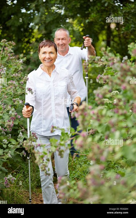 Elderly Couple With Walking Sticks Hi Res Stock Photography And Images