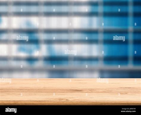 empty wooden desk with office background Stock Photo - Alamy