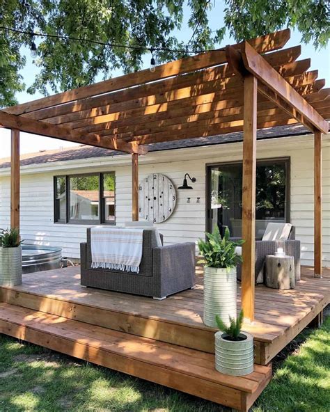 White House With Stained Wood Backyard Pergola Soul Lane