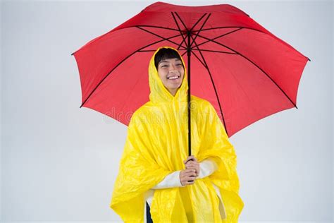 Woman In Yellow Raincoat Holding An Umbrella Stock Image Image Of