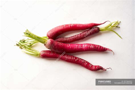 Red Daikon Radish On White Background Healthy Asian Ingredient For