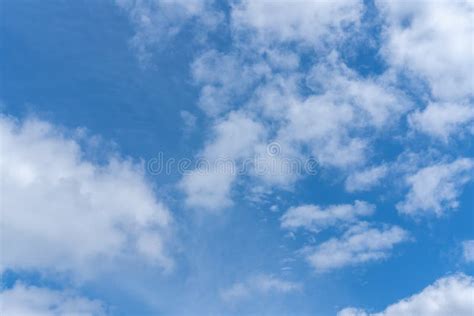 Blue Sky Background With White Fluffy Cumulus Clouds Panorama Of White