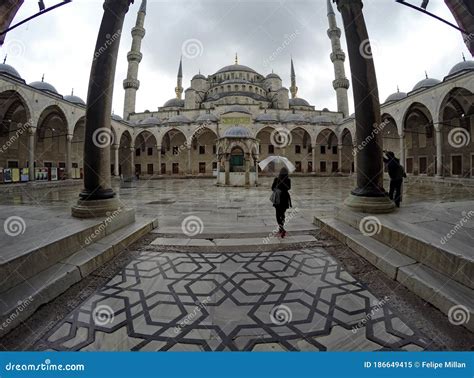 Woman With An Umbrella At Blue Mosque Courtyard Editorial Image Image