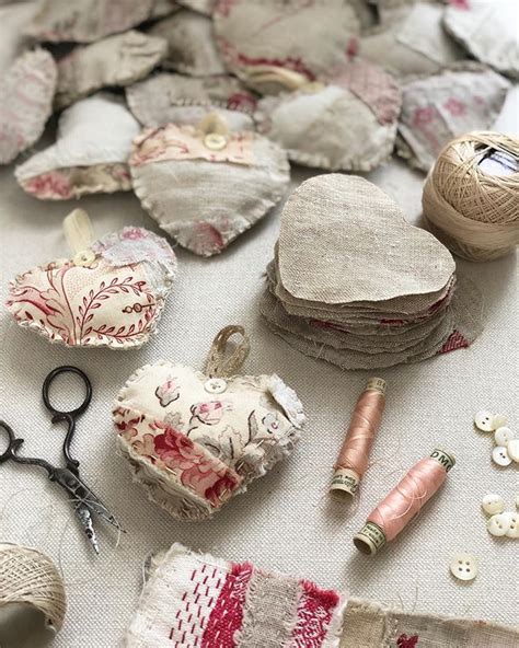 Various Items Are Laid Out On A Table With Thread Scissors And Other