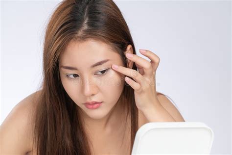 Closeup Portrait Of Gorgeous Asian Woman Looking At Mirror Worry About