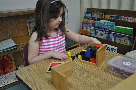 Primary student using Montessori materials in the classroom | Primary ...