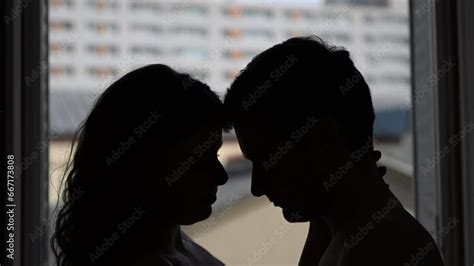 Young Passionate Couple Silhouette Of Two Lovers In The Dark Have