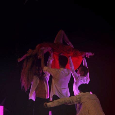 Three People Performing Aerial Acrobatics