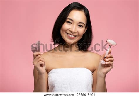 Beautiful Naked Asian Woman Choosing Between Stock Photo 2256615401