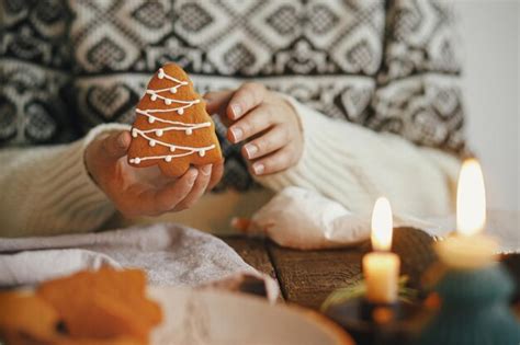 Premium Photo Hands Holding Christmas Tree Gingerbread Cookie On