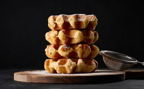 Premium Photo A Stack Of Baked Belgian Waffles Sprinkled With