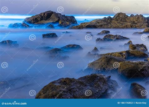 Long Exposure Of Beautiful Blue Bioluminescence On Some Rocks In The