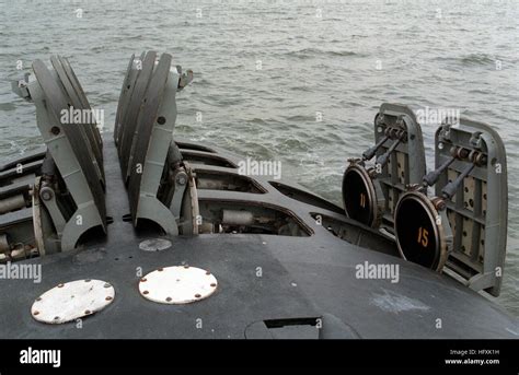 The hatches of the 12 vertical-launch Tomahawk missile tubes stand Stock Photo: 130278109 - Alamy