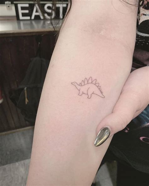 Single Needle Stegosaurus Tattoo Located On The Inner