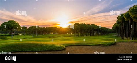 Golf Course At Sunset With Beautiful Sky And Sand Trap Scenic