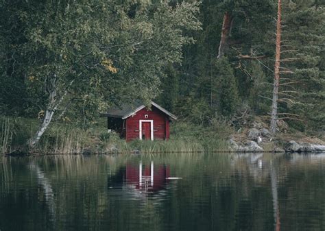 Premium Photo Small Red Wooden House On The Shore Of A Lake In Finland