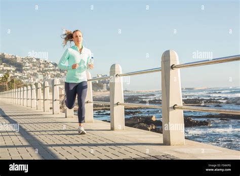 Focused Fit Blonde Jogging At Promenade Stock Photo Alamy