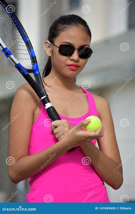 Unemotional Athlete Minority Girl Tennis Player Wearing Sunglasses With Tennis Racket Stock