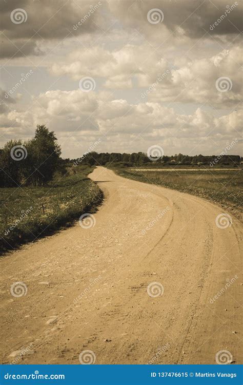 Country Gravel Road With Old And Broken Asphalt Vintage Retro Look