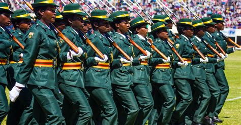 Women in Official Army Uniforms Marching on a Football Stadium · Free ...