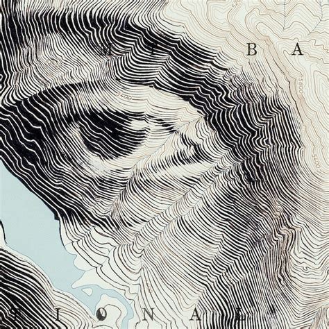 Map Art Sees Faces Emerge From Topographic Contours and Patterns