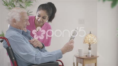 4k Caring Home Support Nurse Helping Elderly Man To Use A Computer