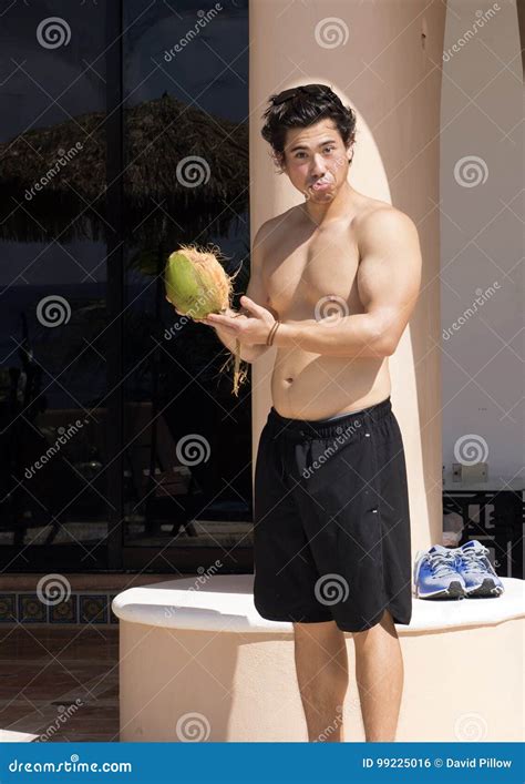 Handsome Young Man Holding A Coconut Stock Photo Image Of Shirtless