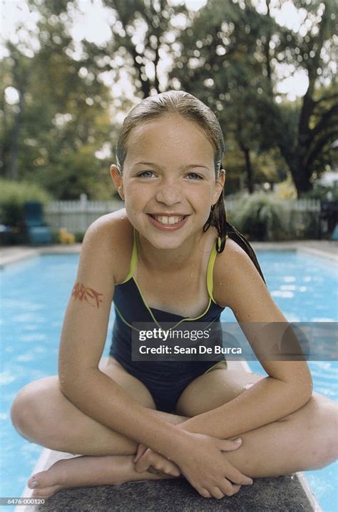 Girl Sitting On Diving Board High Res Stock Photo Getty Images