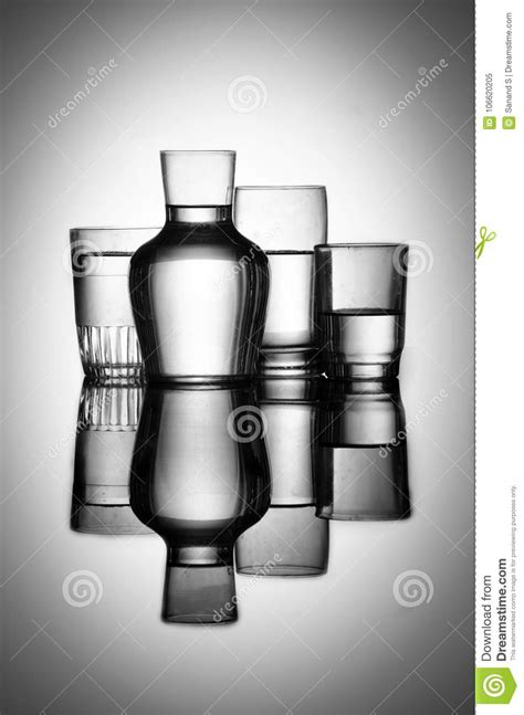 Set Of Glasses Filled With Water On A Reflecting Glass With Backlight Stock Image Image Of