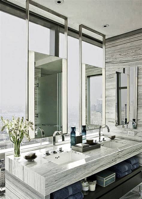 A Large Bathroom With Double Sinks And Mirrors