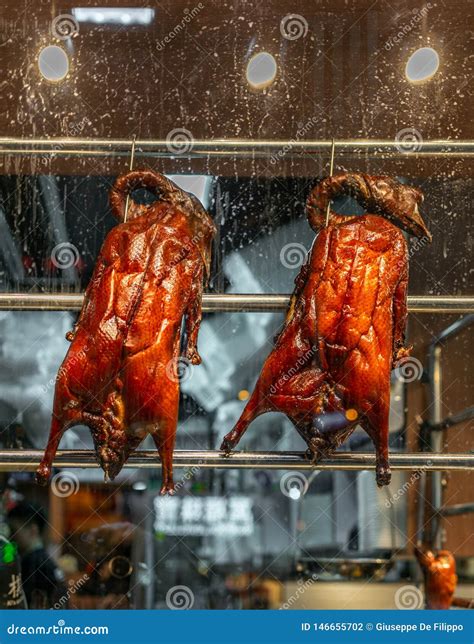 Roasted Peking Ducks Hanging In A Street Restaurant Window In Hong Kong