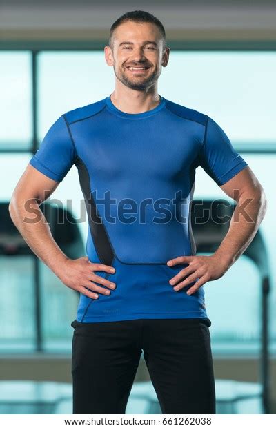 Portrait Handsome Personal Trainer Wearing Sportswear Stock Photo