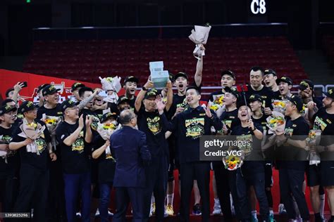 Players of Liaoning Flying Leopards celebrate with the trophy after ...