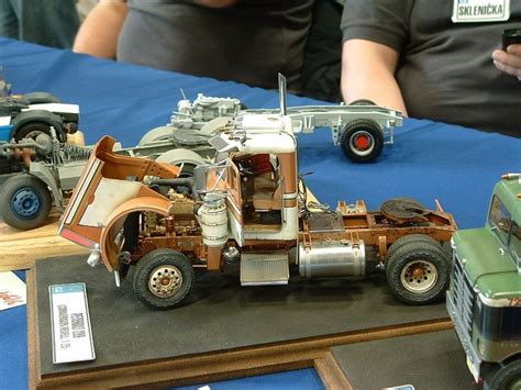 An Old Model Truck Is On Display At A Car Show