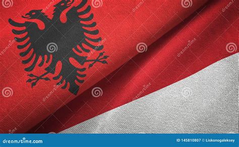 Albania And Indonesia Two Flags Textile Cloth Fabric Texture Stock