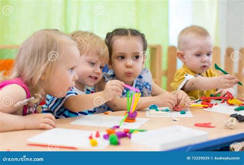 Kids Group Making Arts And Crafts In Kindergarten Children Spending