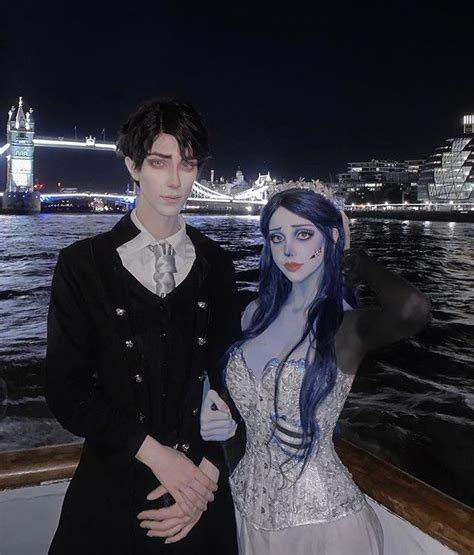 a couple dressed up as corpse bride and groom on a boat in london at night