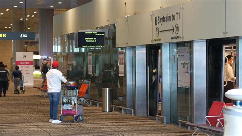 Travelers wait for skytrain elevator in airport 13826683 Stock Video at