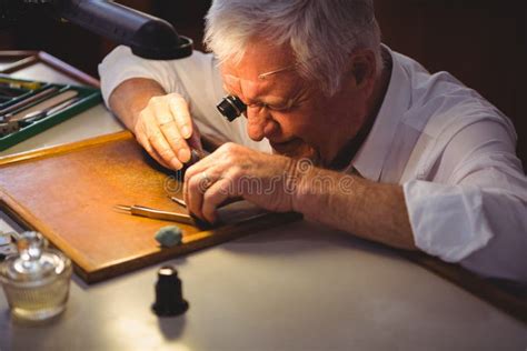 Smiling Horologist Examining Clock Parts In Workshop Stock Photo - Image of repairman, clock ...