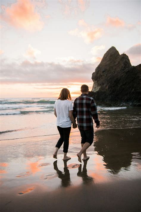 Couple Walking On A Beach - Couple Walking on Beach While Holding Hands · Free Stock Photo