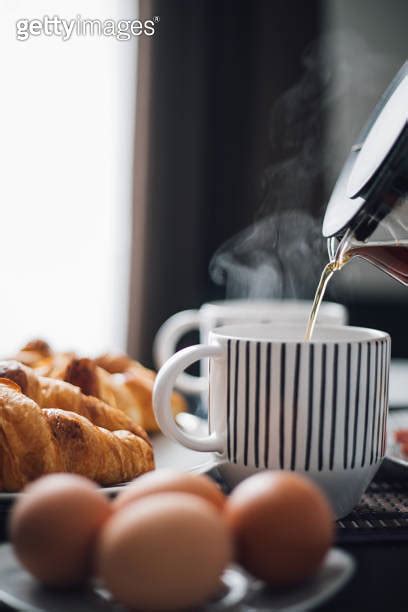 Breakfast With Cup Of Coffee And Croissants