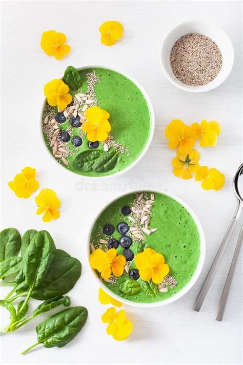 Green Spinach Smoothie Bowl With Blueberry Chia Seed And Edible Pansy