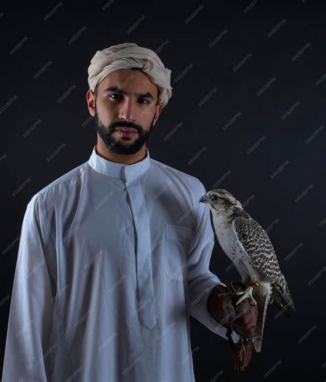 Premium Photo Young Arab Prince Holding A Bird Of Prey